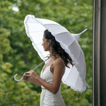 The fancy white umbrella from Clean Heels is perfect for a bride on her wedding day